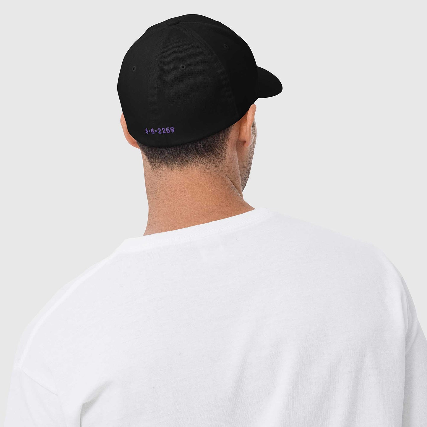Black fitted baseball hat with subtle embroidery front and back