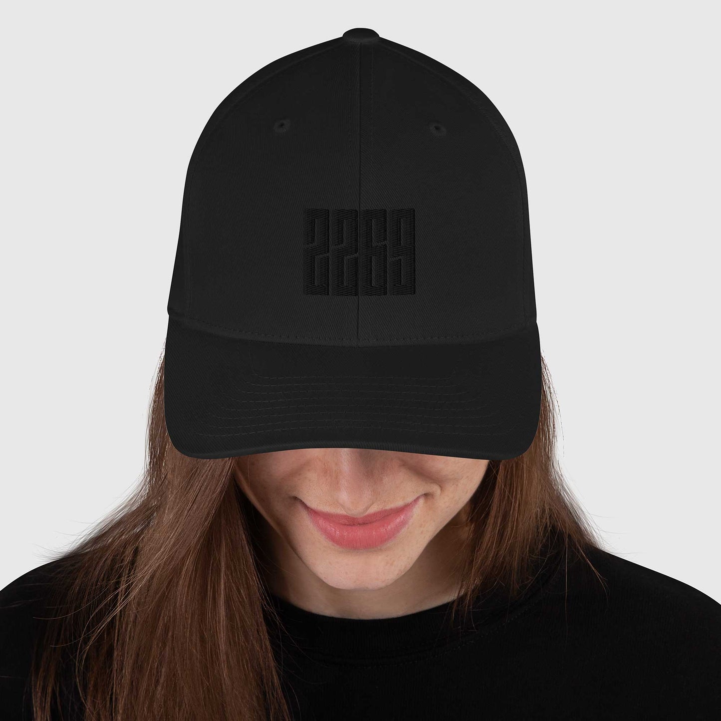 Black fitted baseball hat with subtle embroidery front and back