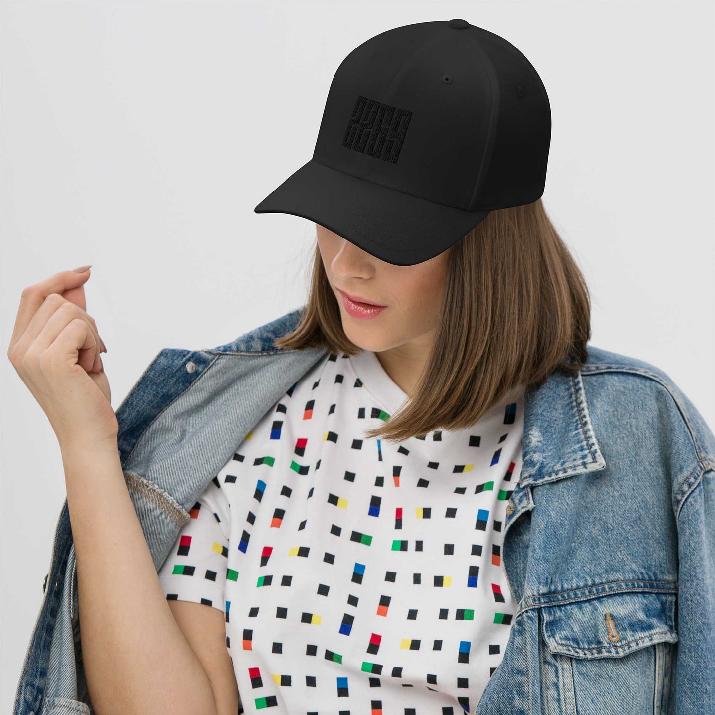 Black fitted baseball hat with subtle embroidery front and back