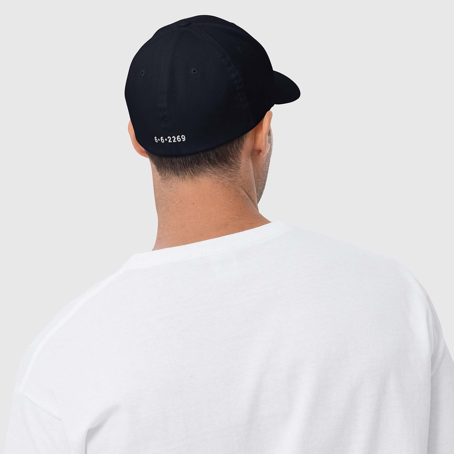 Dark navy fitted baseball hat with white embroidery front and back