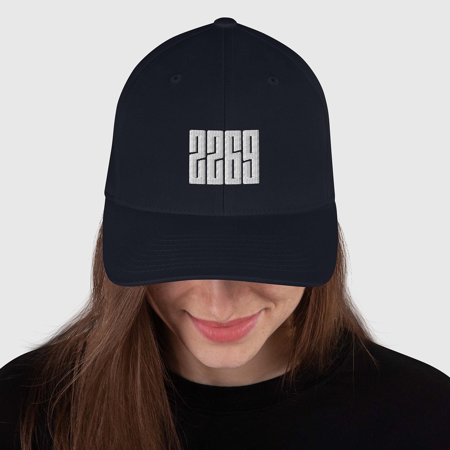Dark navy fitted baseball hat with white embroidery front and back