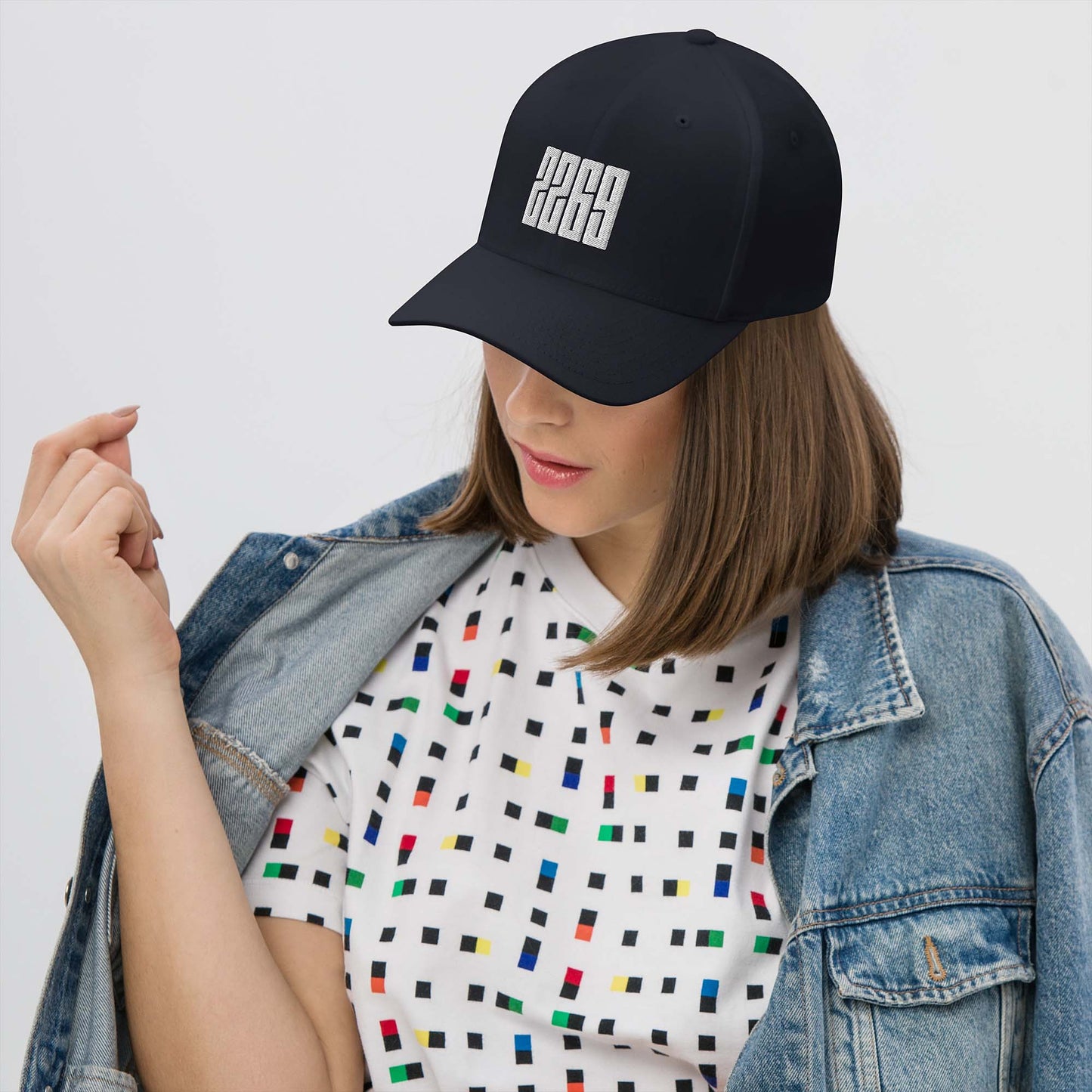 Dark navy fitted baseball hat with white embroidery front and back