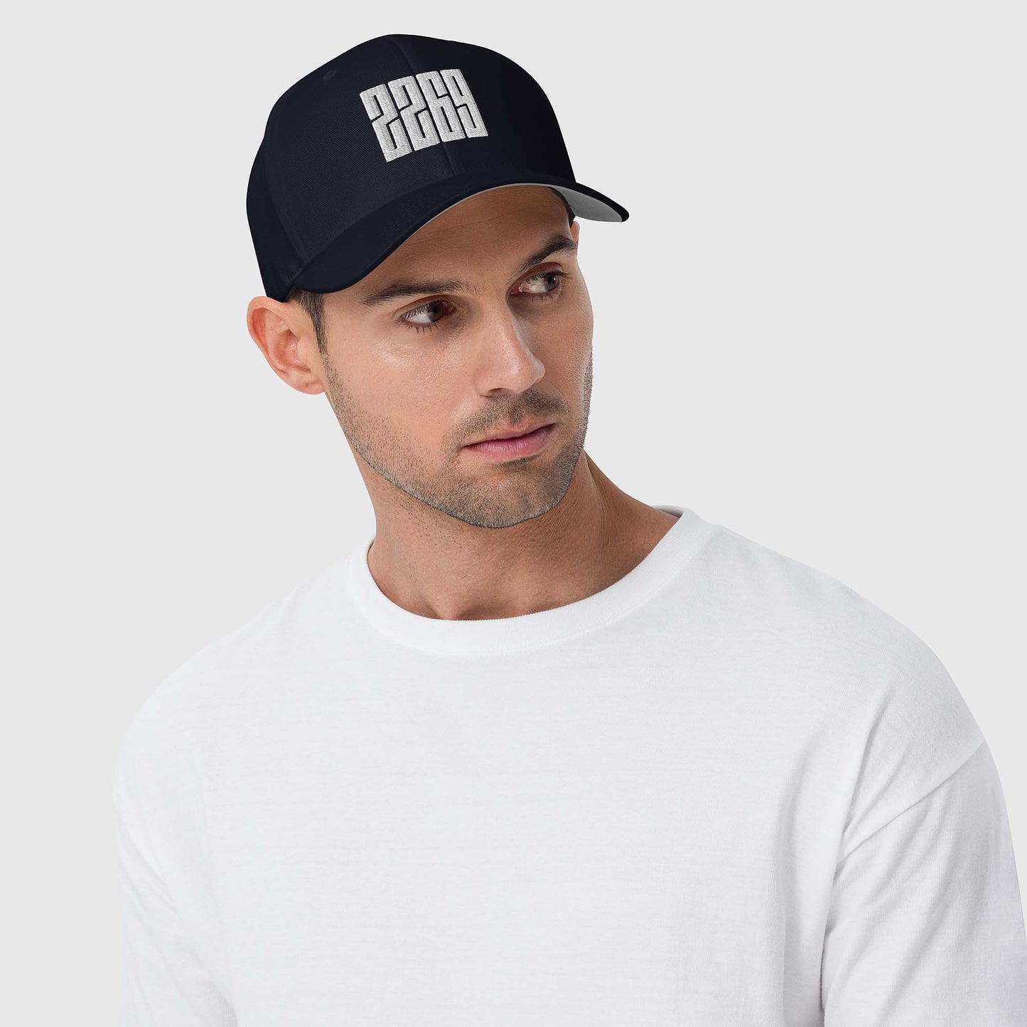 Dark navy fitted baseball hat with white embroidery front and back