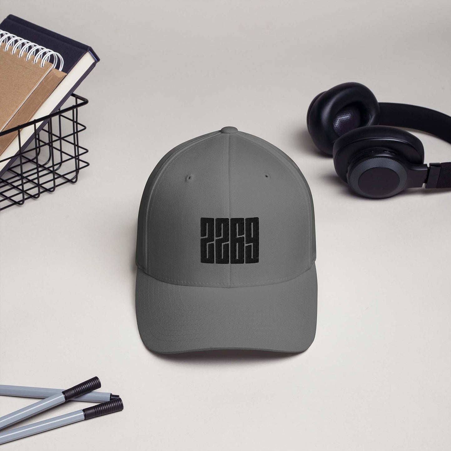 Grey fitted baseball hat with black embroidery front and back