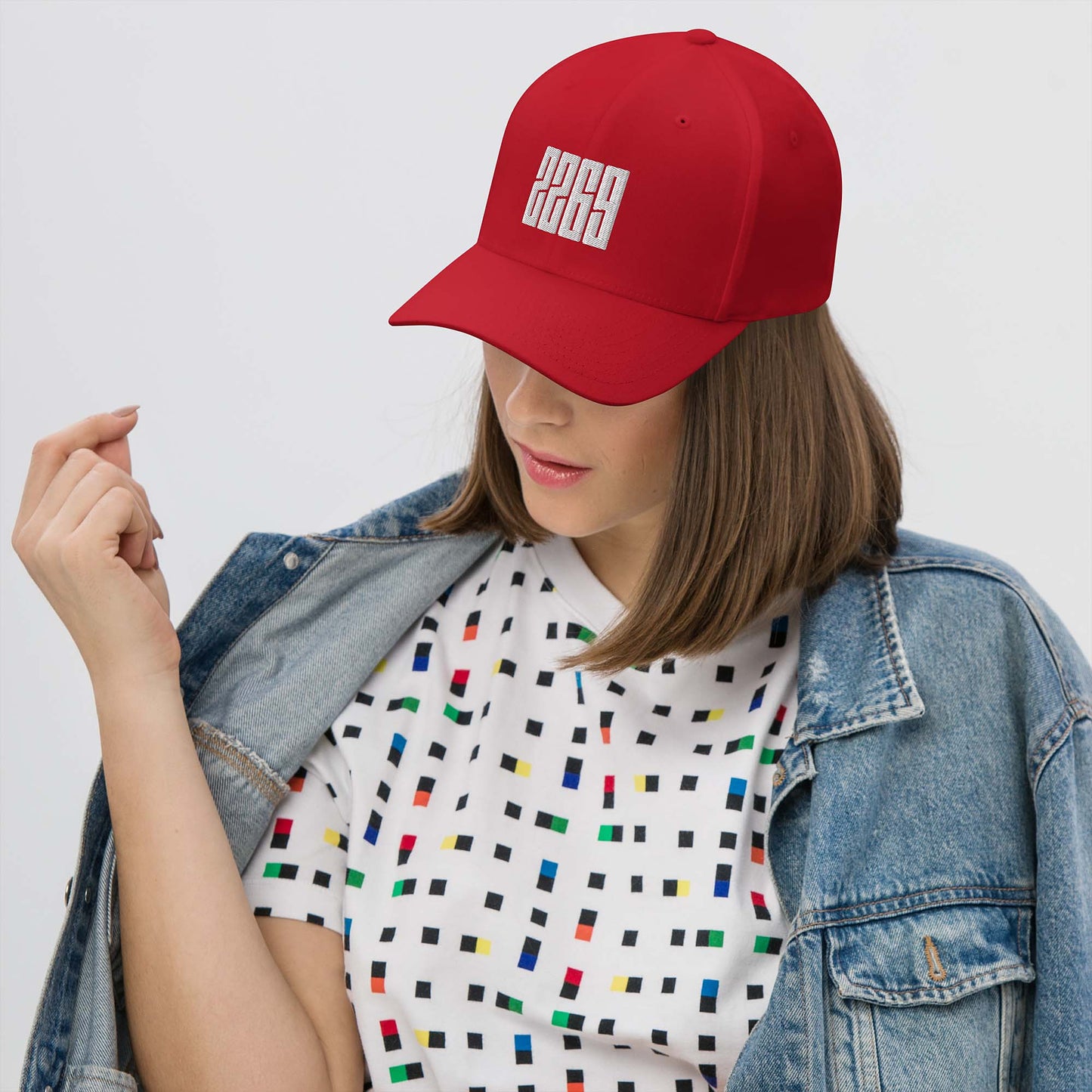 Red fitted baseball hat with white embroidery front and back