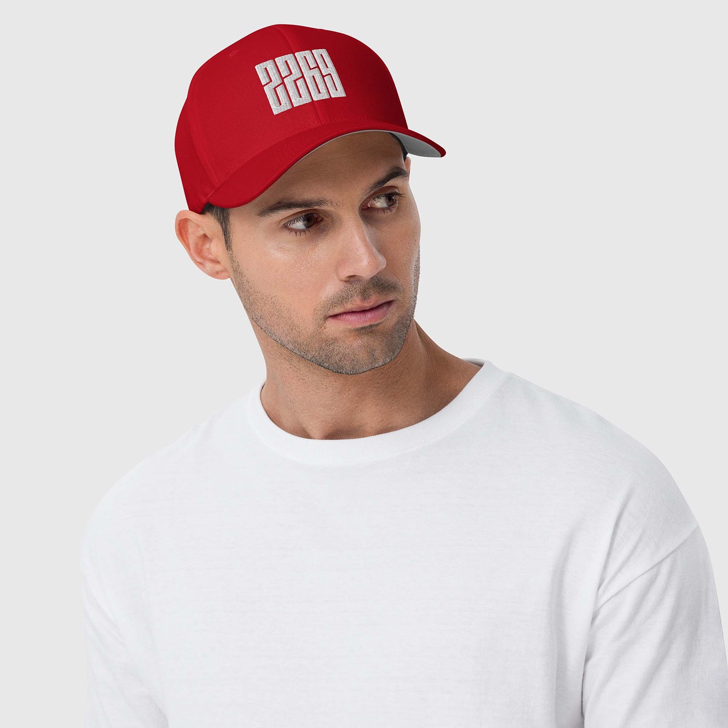 Red fitted baseball hat with white embroidery front and back