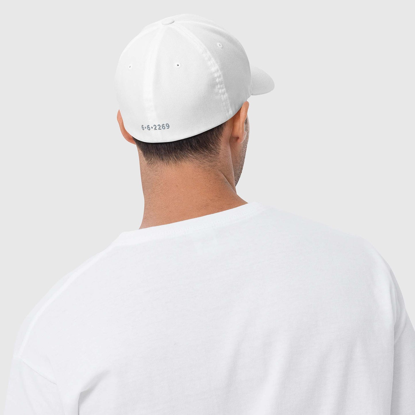 White fitted baseball hat with subtle embroidery front and back
