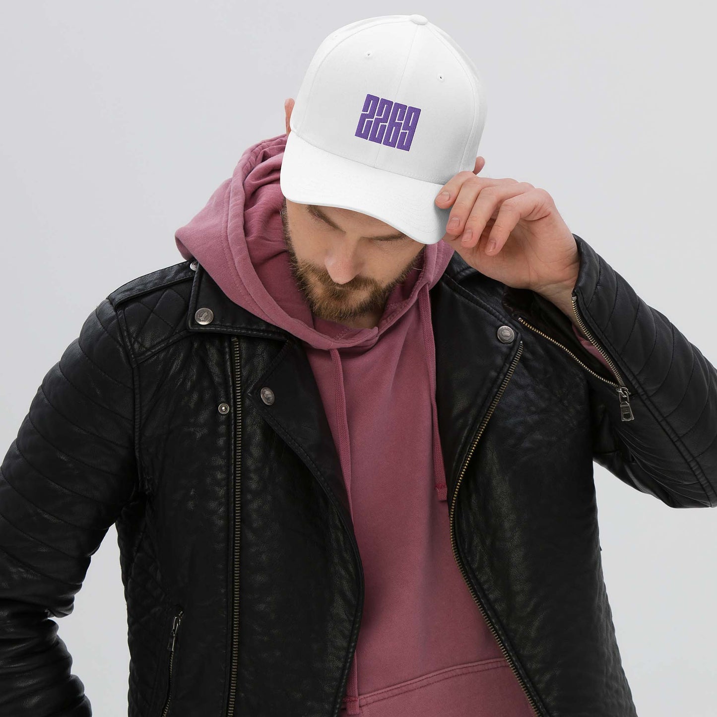 White fitted baseball hat with purple embroidery front and back