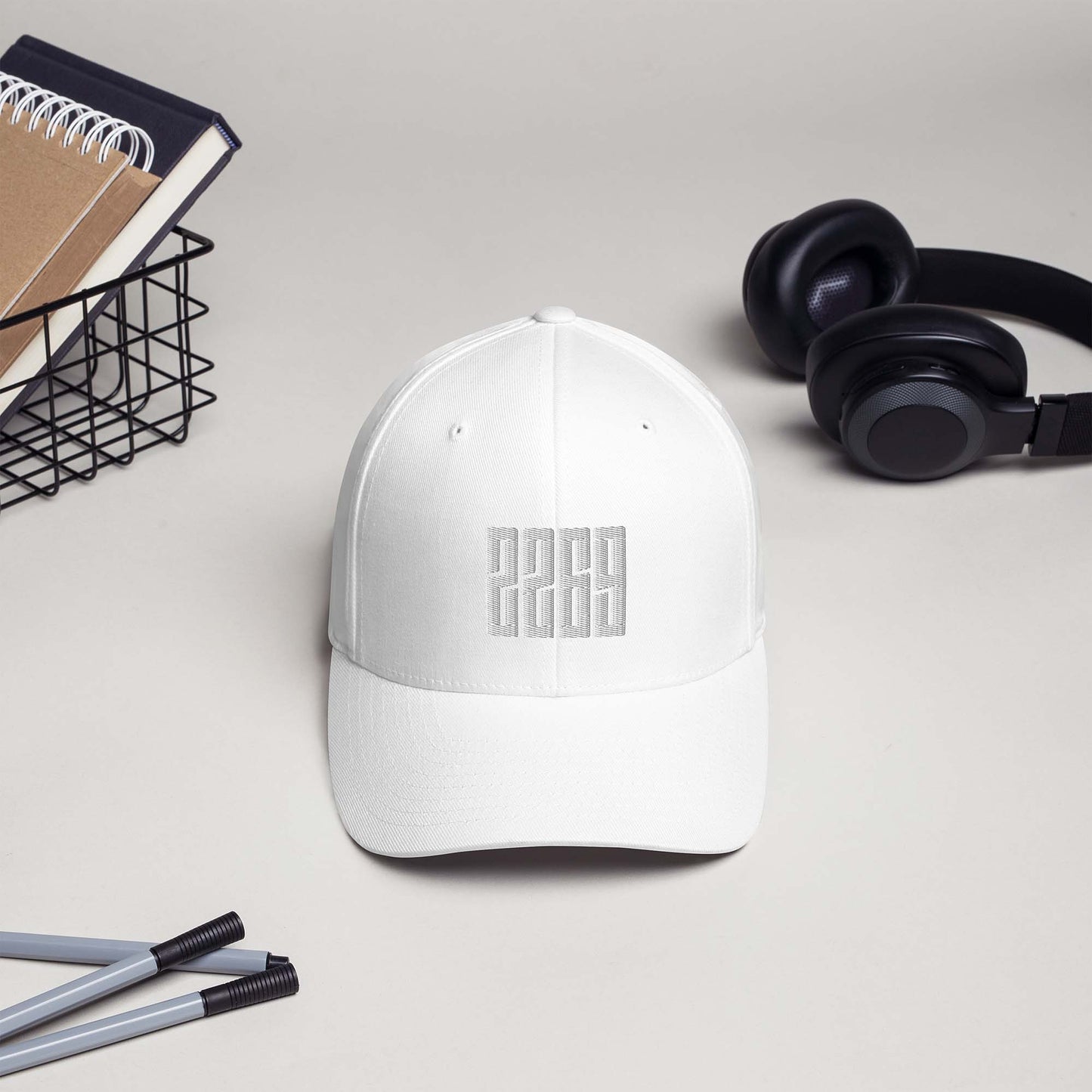 White fitted baseball hat with subtle embroidery front and back