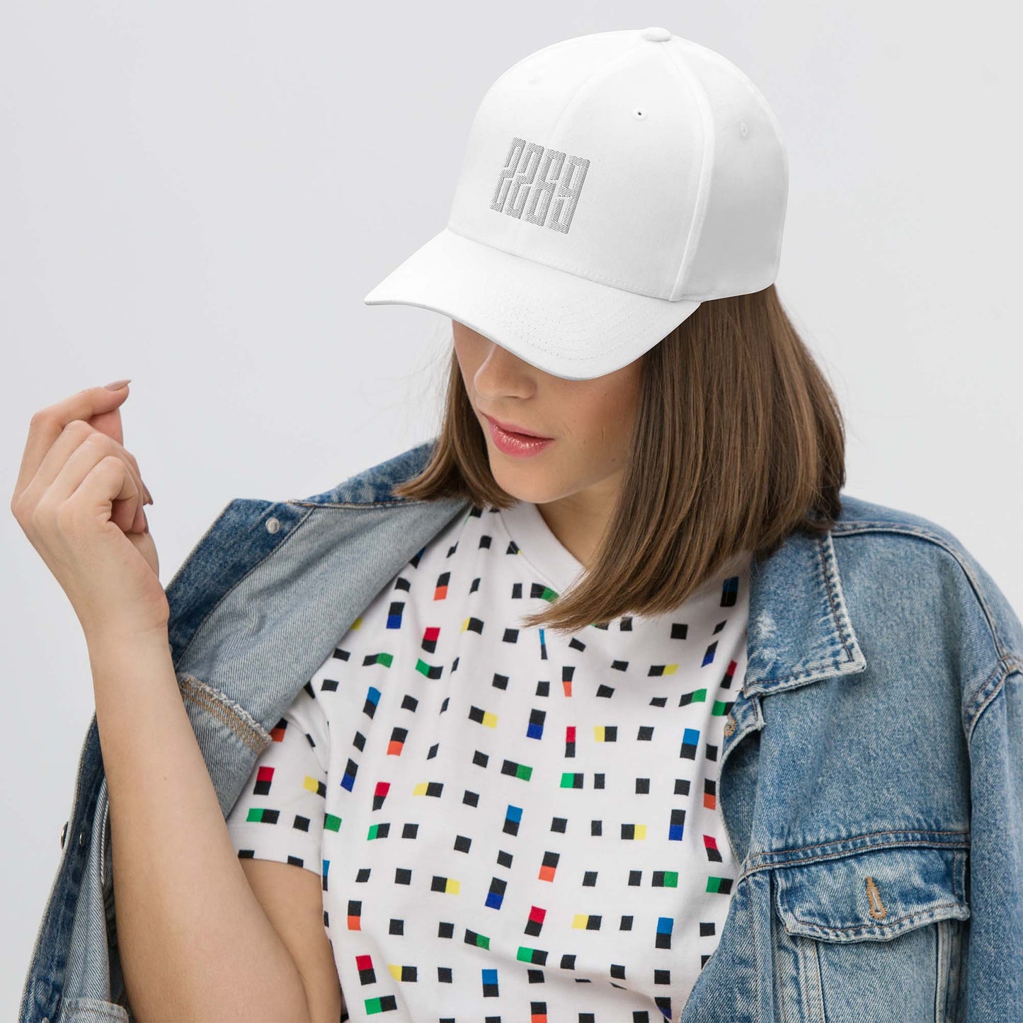 White fitted baseball hat with subtle embroidery front and back