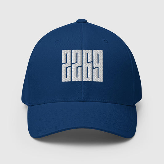 Royal blue fitted baseball hat with white embroidery front and back